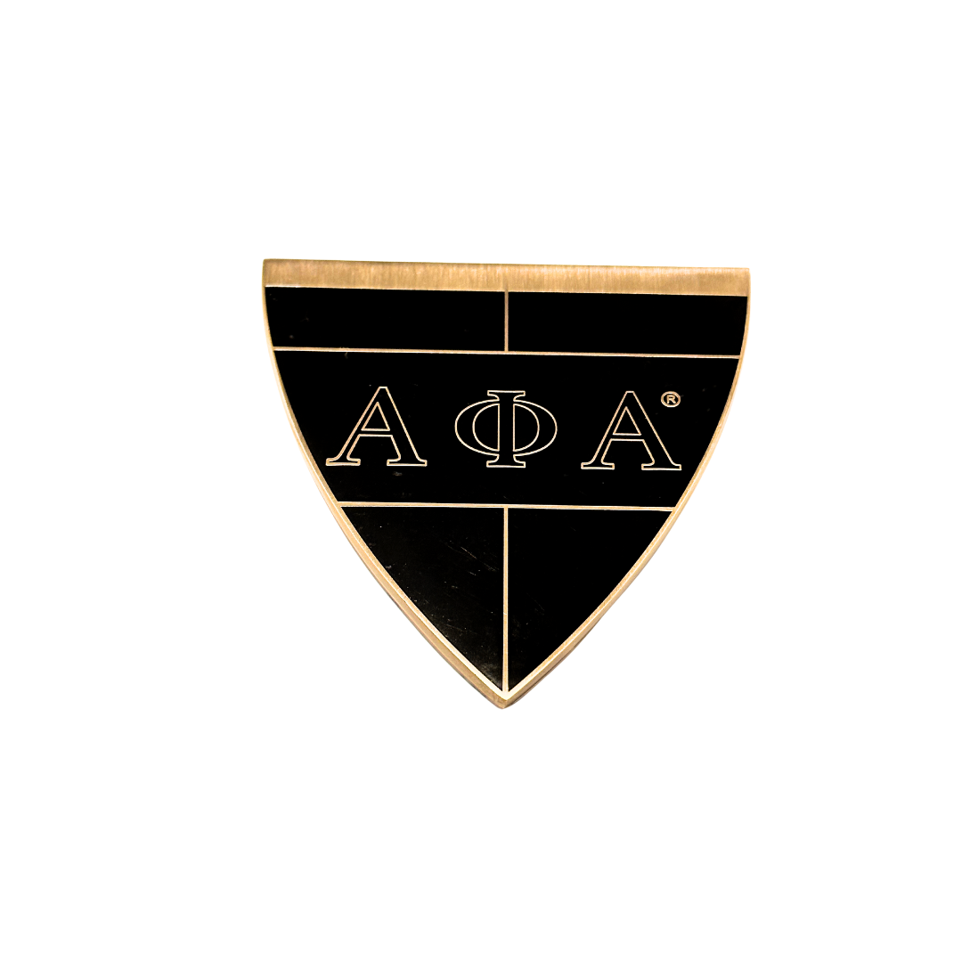 Antique Gold metal alloy emblem with black enamel and the greek symbols for Alpha Phi Alpha etched in the gold.